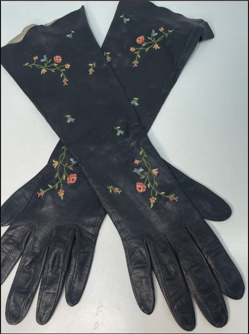 Flower embroidered black leather opera gloves.